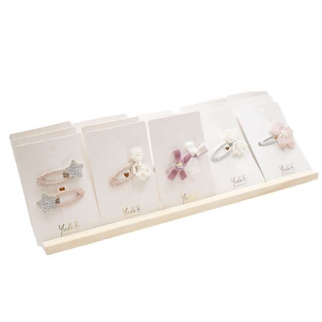 Offre 24 barrettes à cheveux collection Paris + présentoir offert
